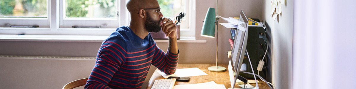 man studying on computer